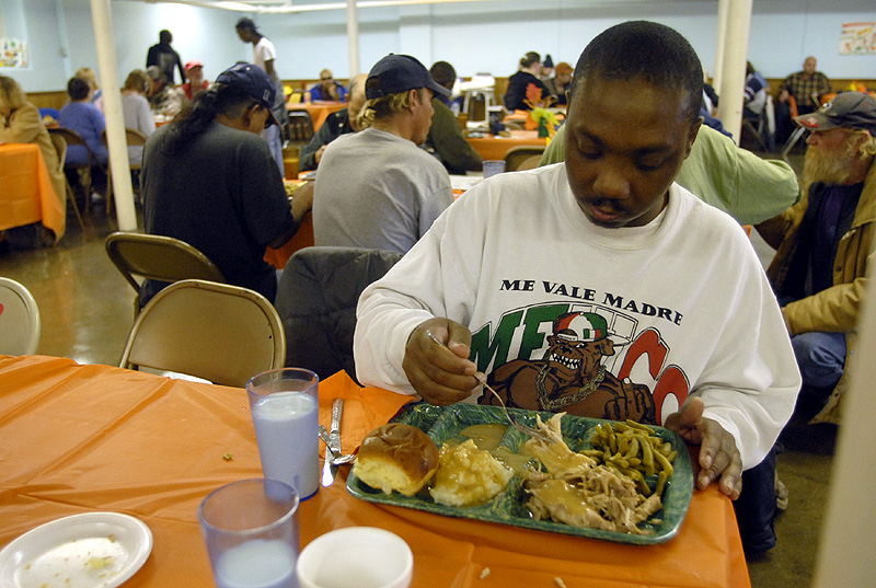 Richard Gwin/Journal World-Photo
LINK served up it's annual Thanksgiving meal to many on Thursday afternoon at the LINK kitchen while many like Jerry Davis 37 of Lawrence were happy to get a hot Thanksgiving meal.
